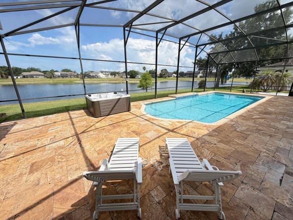 BRAND NEW! Lakefront 9BR Pool Hot Tub Outdoor Kitchen BBQ Theater 2 miles Disney
